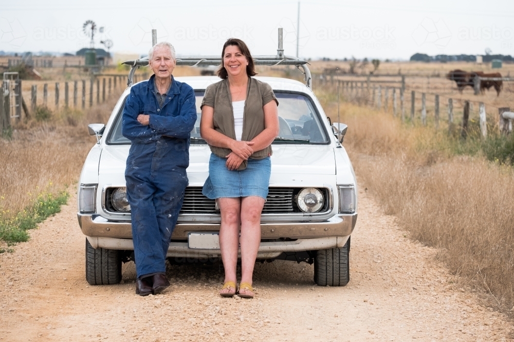 Elderly farmer and his daughter on a country road. - Australian Stock Image
