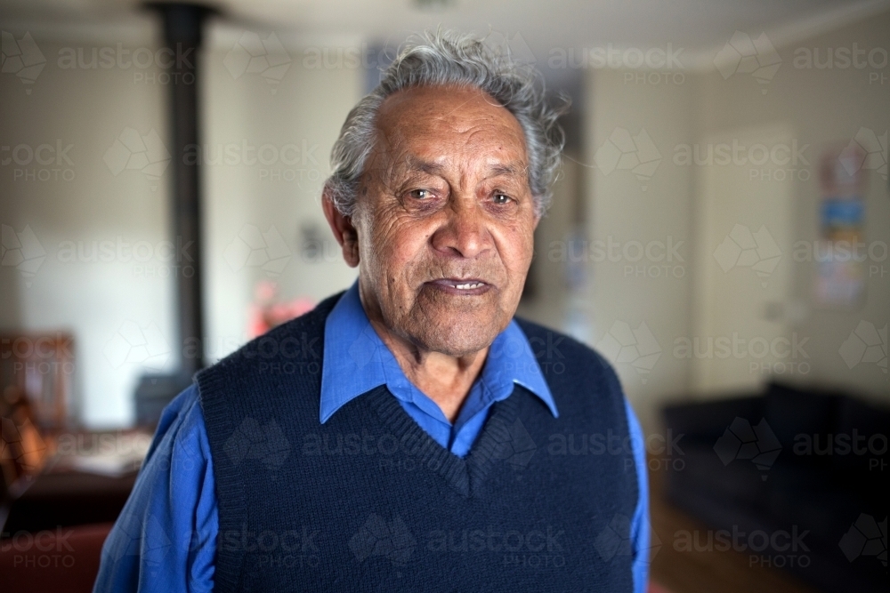Elderly indigenous man at home - Australian Stock Image