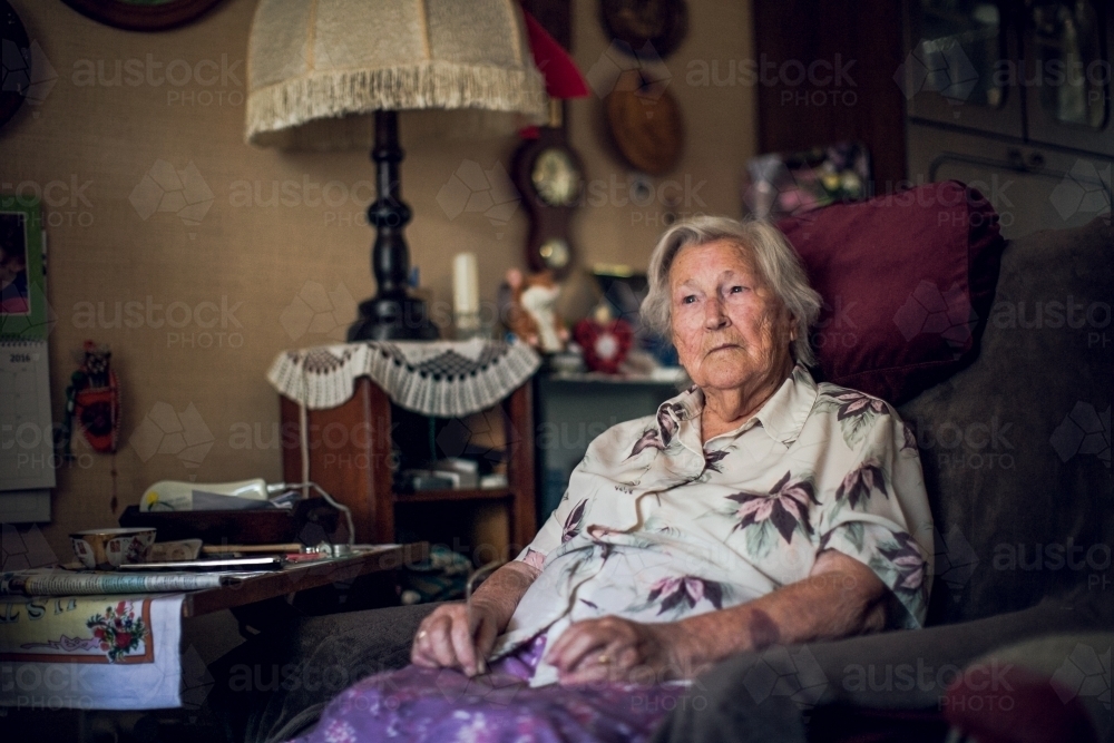 Elderly lady, a centenarian, in her living room at home - Australian Stock Image