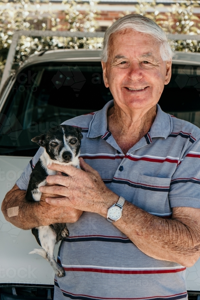 Elderly man and his little dog - Australian Stock Image