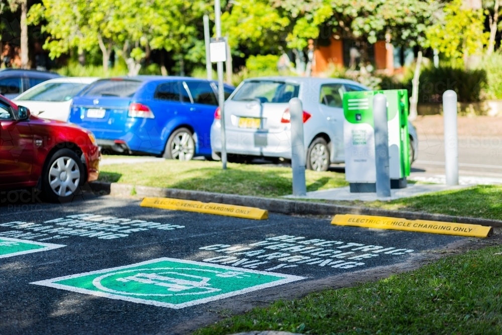 Electric charging only car park sign on road - Australian Stock Image