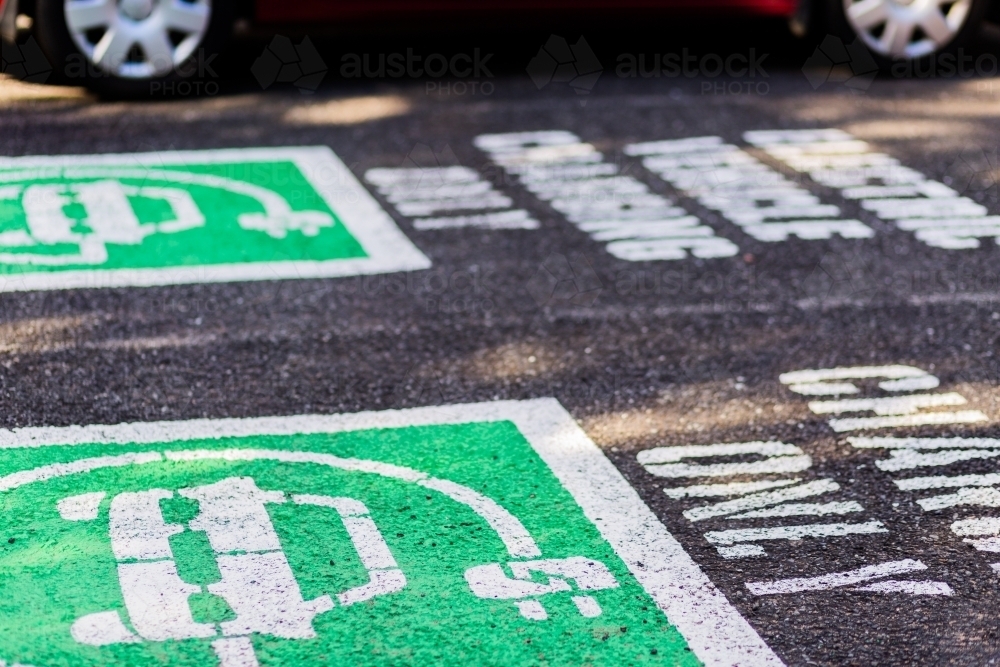 Electric charging only car park sign on road - Australian Stock Image