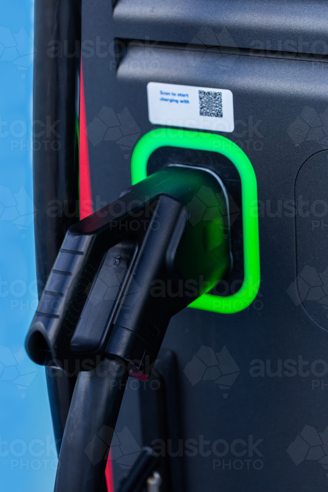 Electric vehicle charging station plug - Australian Stock Image