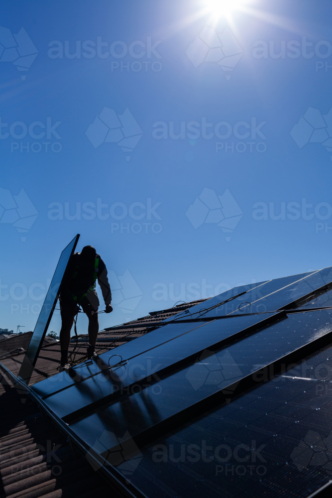 Image of Electrician tradie man connecting bifacial solar panels ...