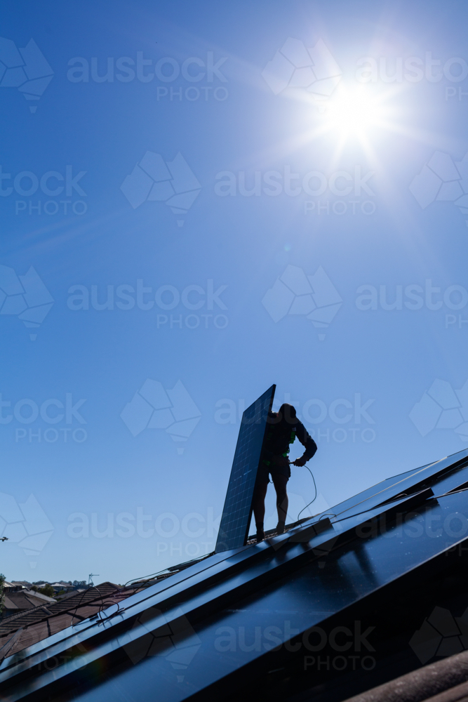 Image of Electrician tradie man connecting bifacial solar panels ...