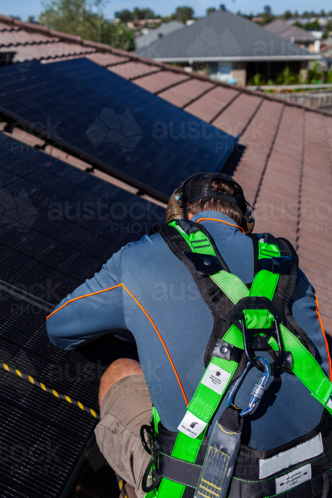 Image of Electrician tradie working on solar panel installation ...