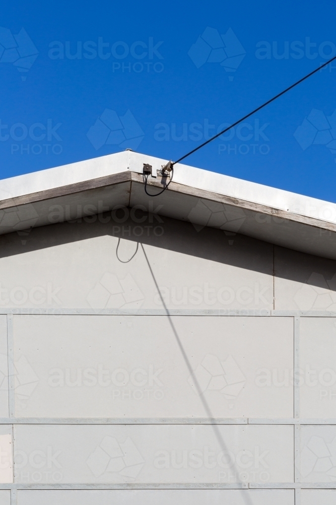 Electricity cable entering a house - Australian Stock Image