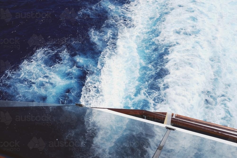 Elevated view down towards water behind a cruise ship - Australian Stock Image