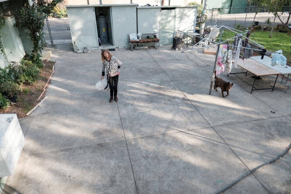 Elevated View of Aboriginal Woman in Backyard - Australian Stock Image