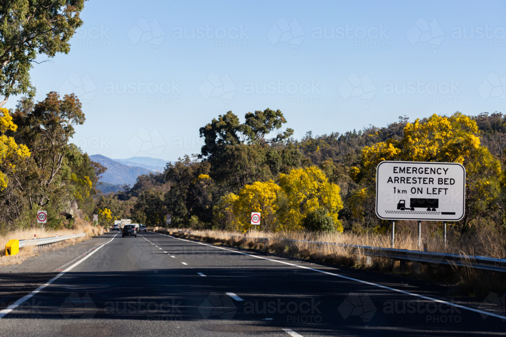 Image Of Emergency Arrester Bed On Left Sign For Trucks On Highway Road image-of-emergency-arrester-bed-on-left-sign-for-trucks-on-highway-road