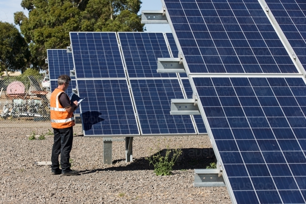 Employee taking notes at Solar Panel plant - Australian Stock Image