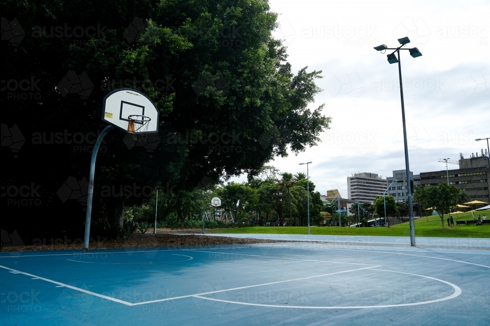 Empty basketball court in local park - Australian Stock Image
