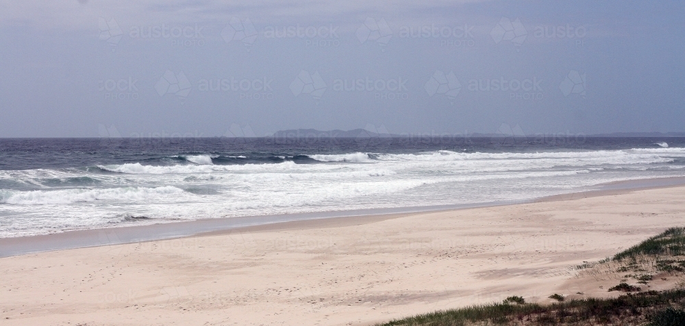 Empty beach on overcast day - Australian Stock Image