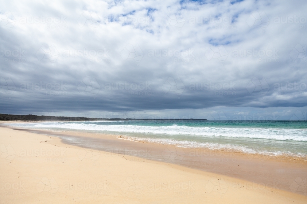 Empty beach on overcast day - Australian Stock Image
