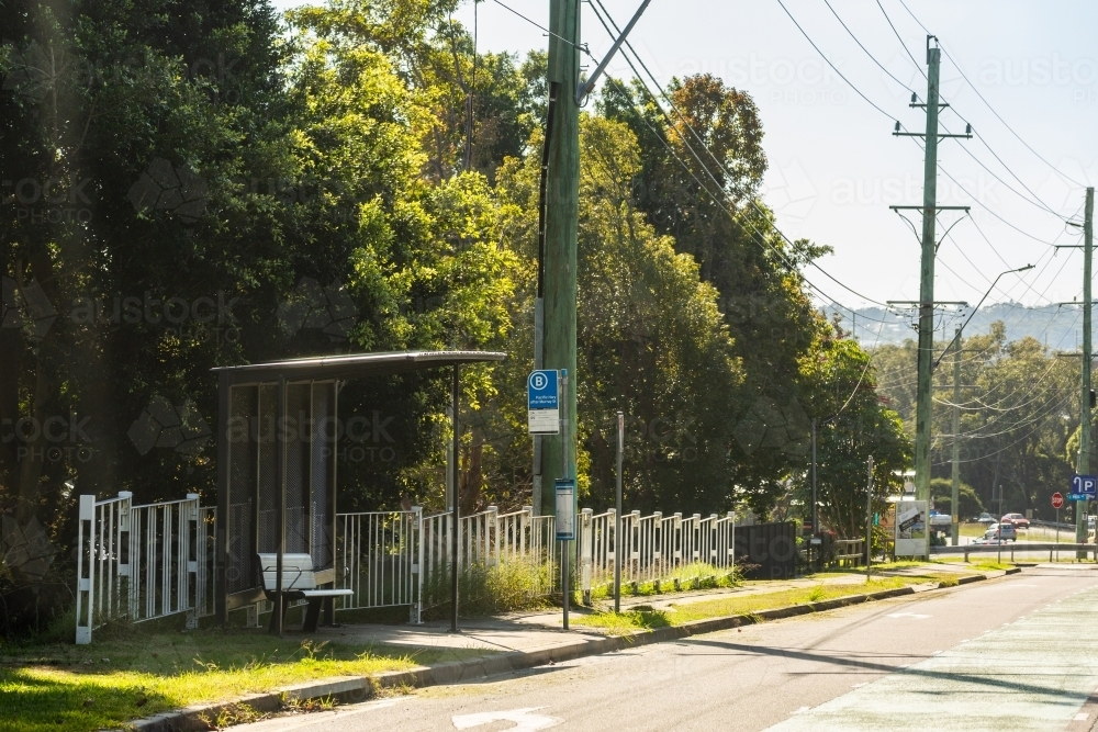 empty bus stop beside road in Hunter Valley - Australian Stock Image