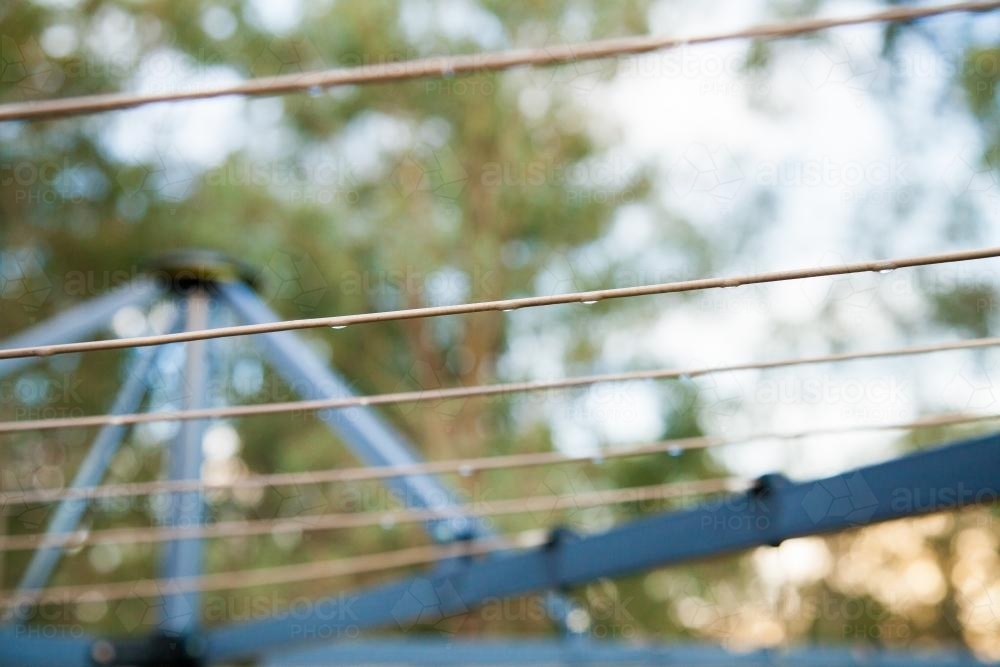 Empty clothesline at sunset after rain - Australian Stock Image