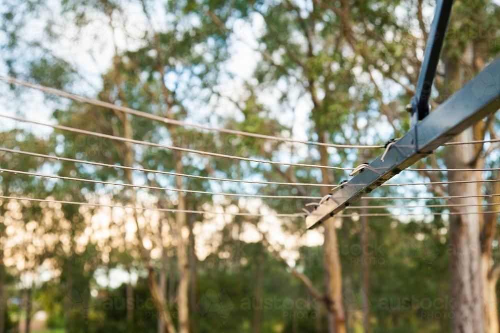 Empty clothesline at sunset after the rain - Australian Stock Image