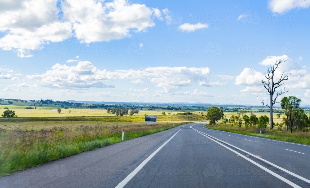 Empty country road on sunlit day - New England Highway NSW - Australian Stock Image