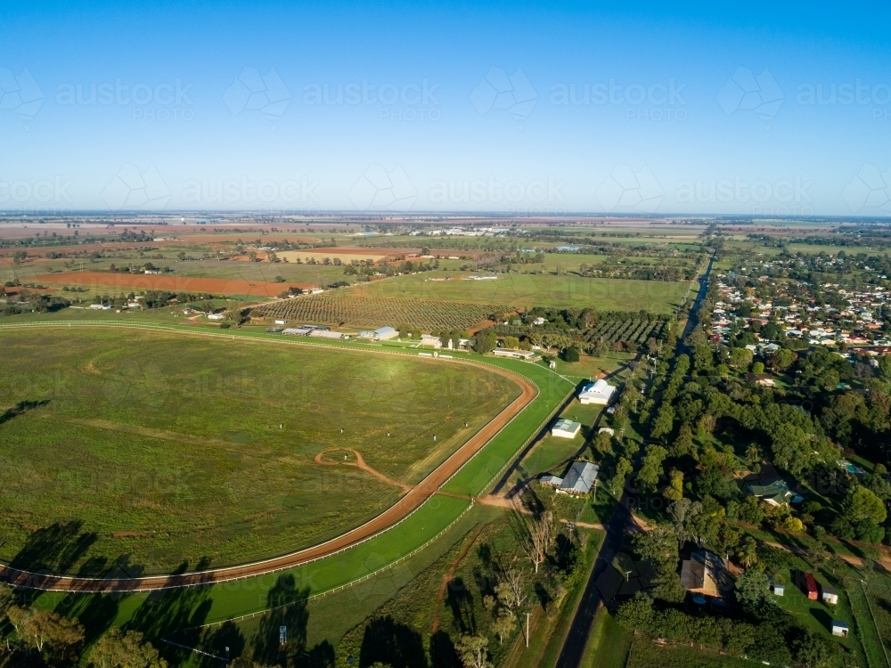 Empty country showground oval and racecourse seen from the air on sunlit day - Australian Stock Image