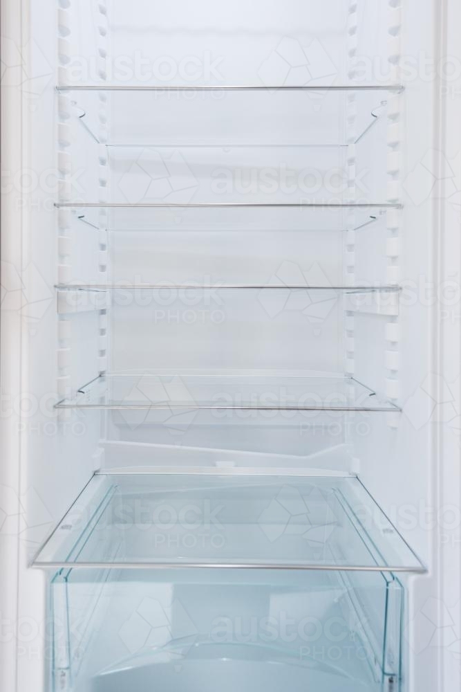 empty new, clean fridge - Australian Stock Image