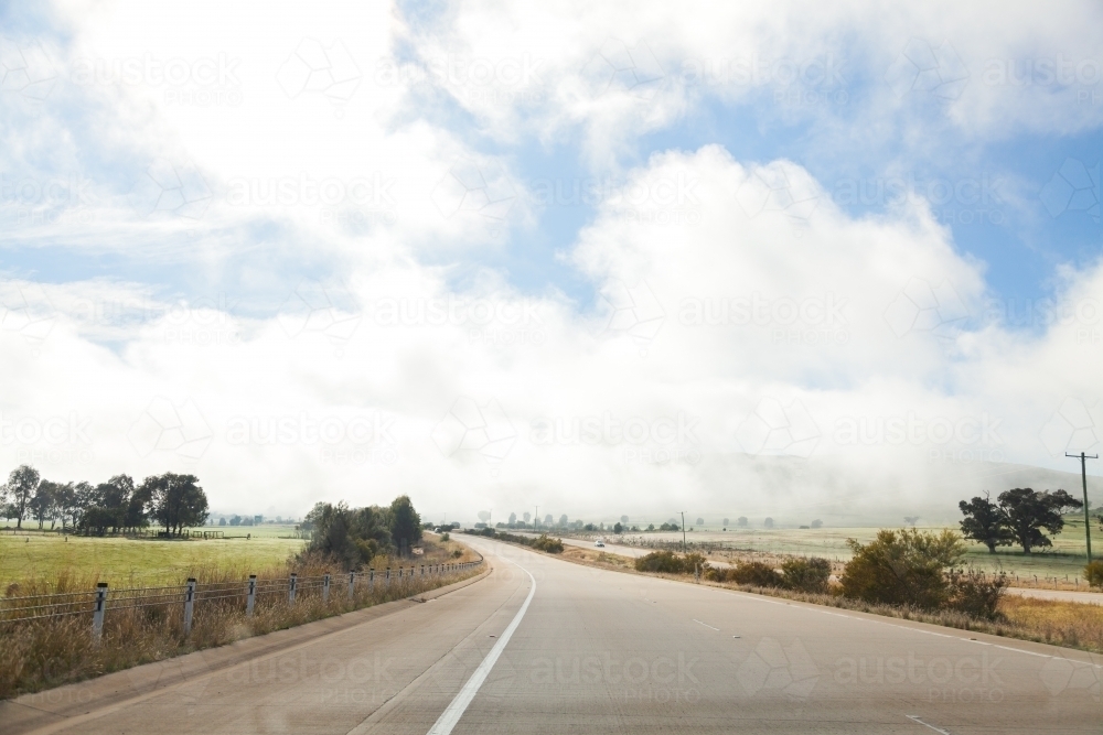 Empty open road and fog ahead on highway - Australian Stock Image