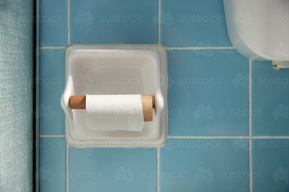 Empty toilet paper roll in bathroom - Australian Stock Image