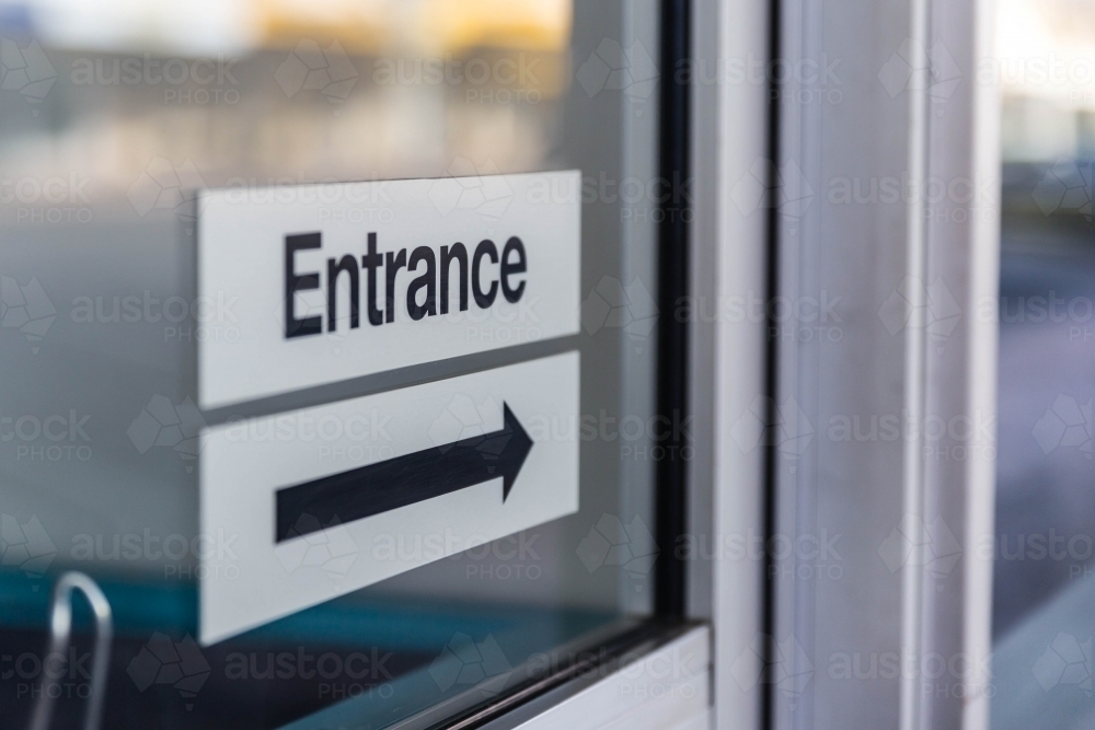 Entrance sign with black arrow - Australian Stock Image