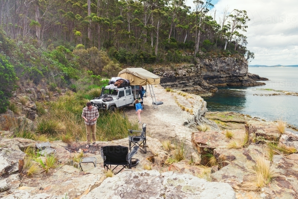 epic campsite on a ledge by the ocean, Bruny Island, Tasmania - Australian Stock Image