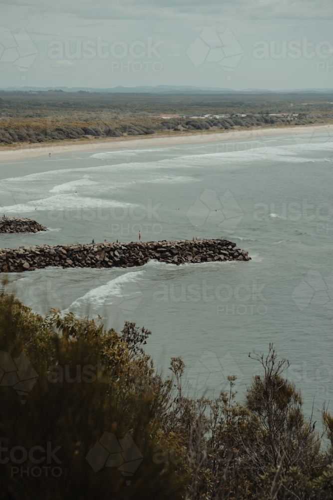 Evan's Head main beach and breakwall as seen from Razorback Lookout. : Austockphoto Evan's Head main beach and breakwall as seen from Razorback Lookout. - Australian Stock Image