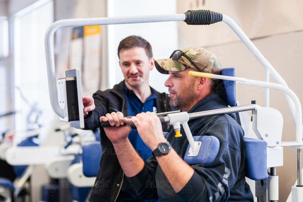 Image of exercise therapy equipment in use at physiotherapy clinic ...