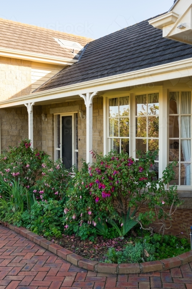 Image of Exterior of sandstone house Austockphoto