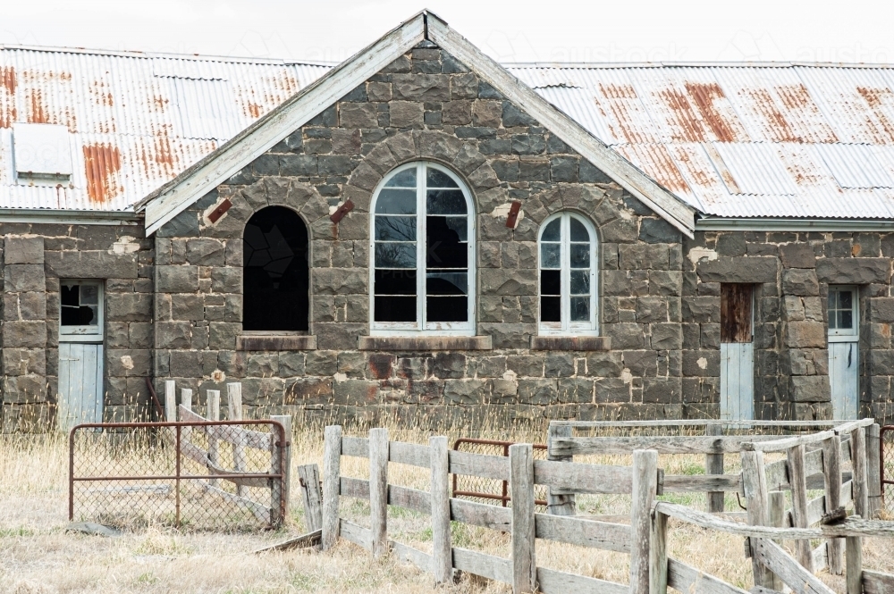 exterior view of abandoned blustone shearing shed - Australian Stock Image