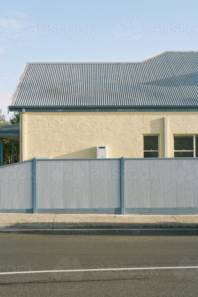 External street view of outside of cream house - Australian Stock Image