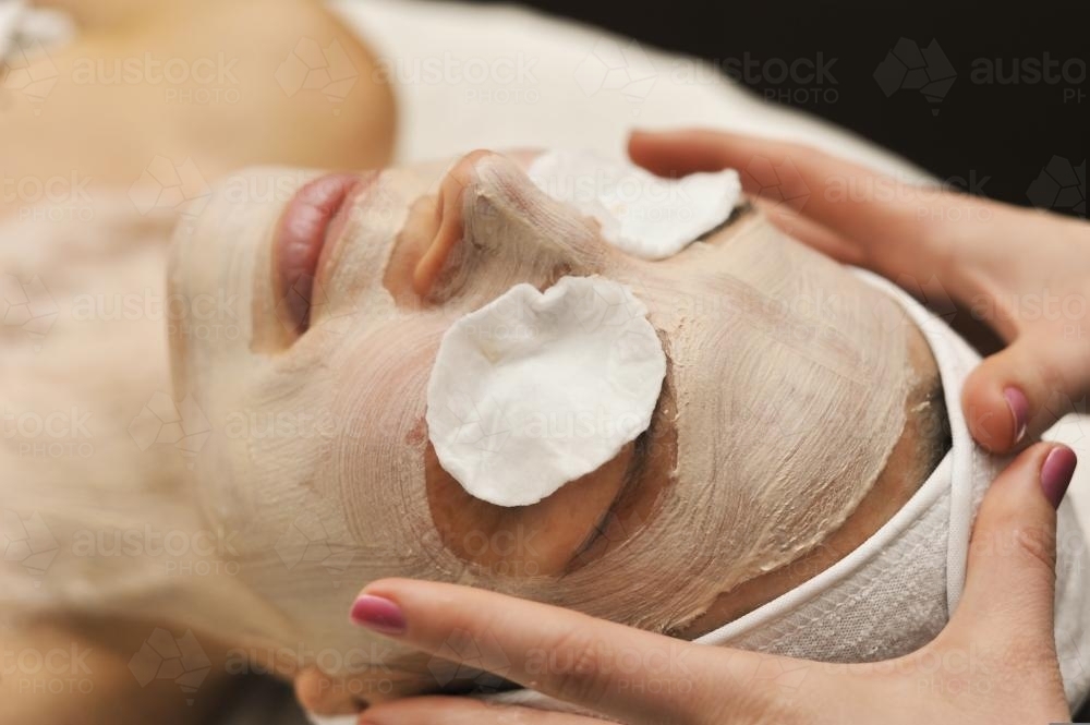 Facial beauty treatment, with hands - Australian Stock Image