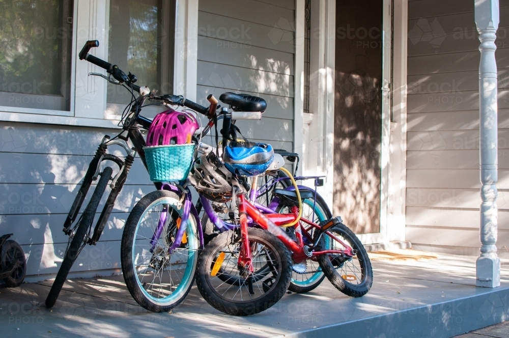 Family bikes on front porch - Australian Stock Image