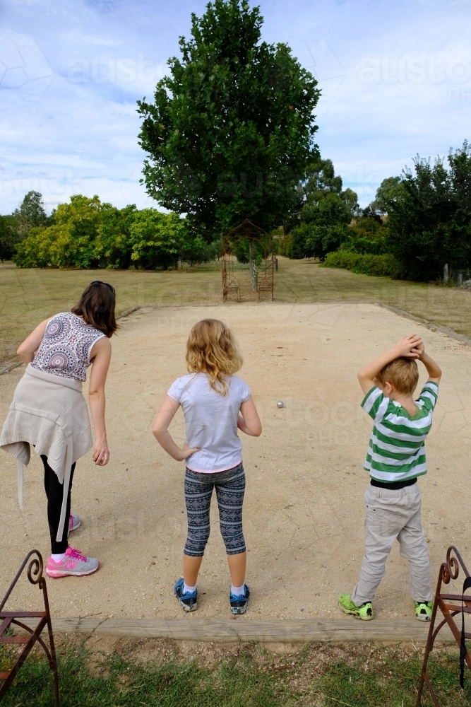 Family playing boules / petanque / bocce - Australian Stock Image