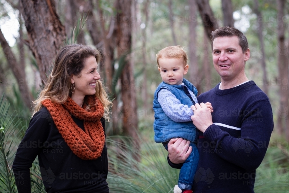 Family portrait in bush setting of Mum, Dad and toddler - Australian Stock Image