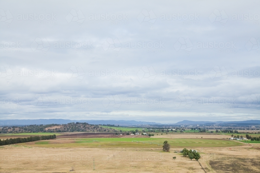 Farm land in winter with overcast sky - Australian Stock Image
