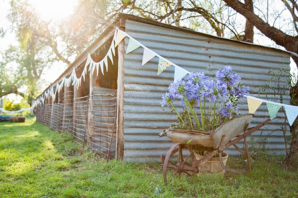 Farm sheds decorated with bunting for country wedding - Australian Stock Image