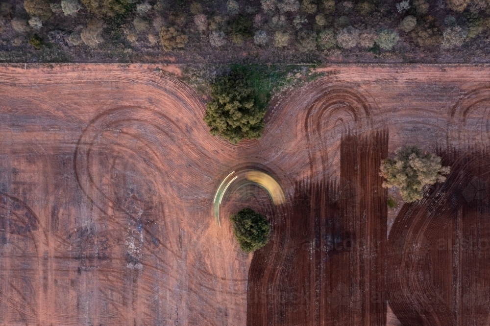 Farm vehicle does U turn while ploughing paddock - Australian Stock Image