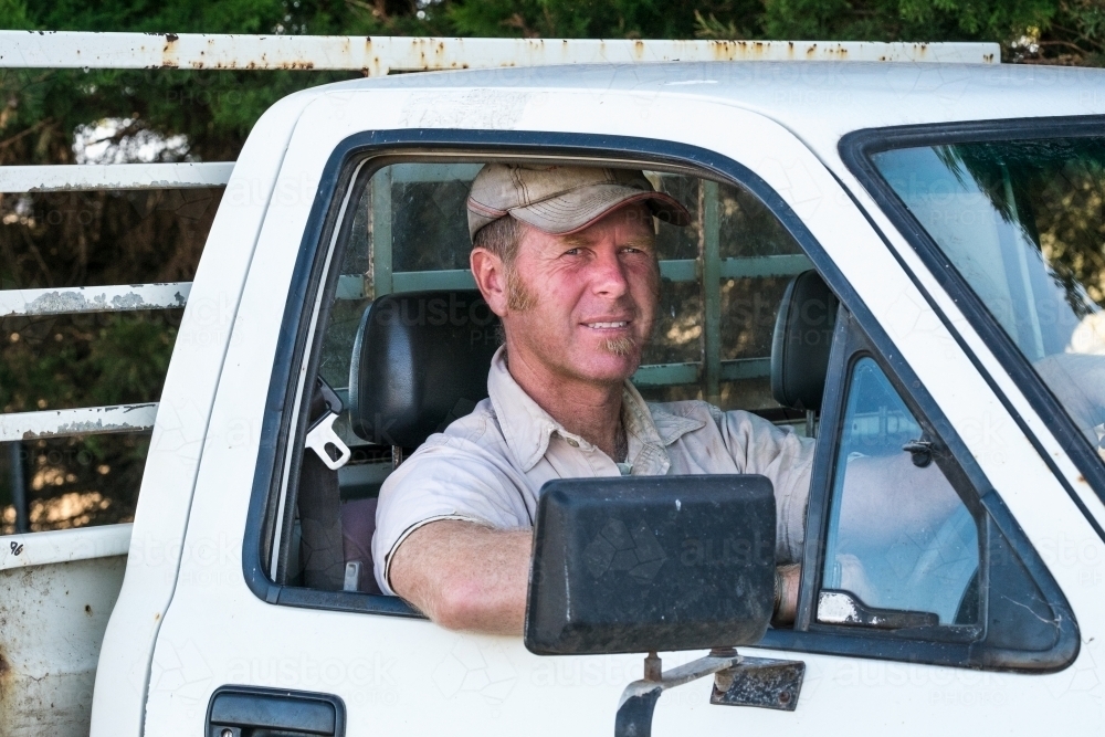 Farmer smiling in his ute - Australian Stock Image