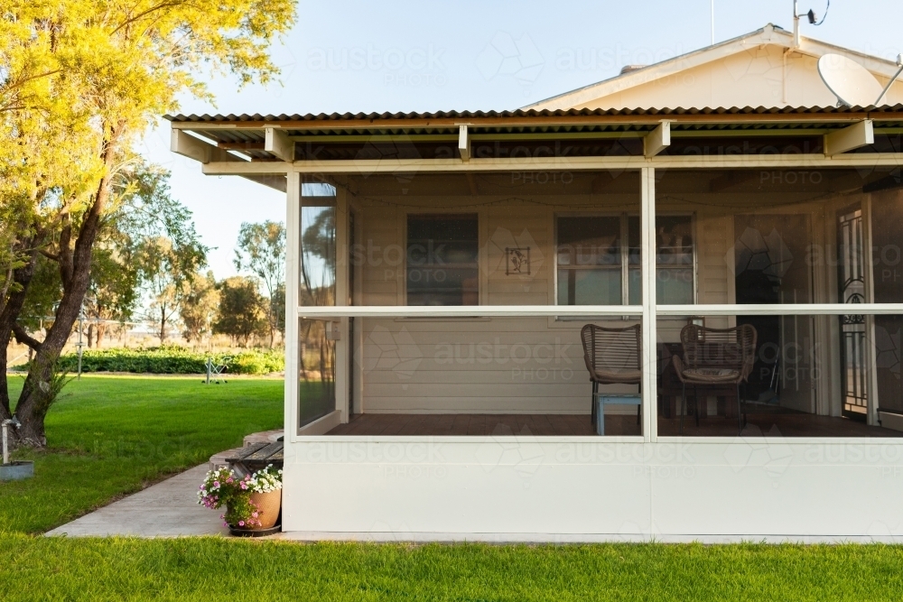 Farmhouse with fly screen veranda enclosed deck - Australian Stock Image