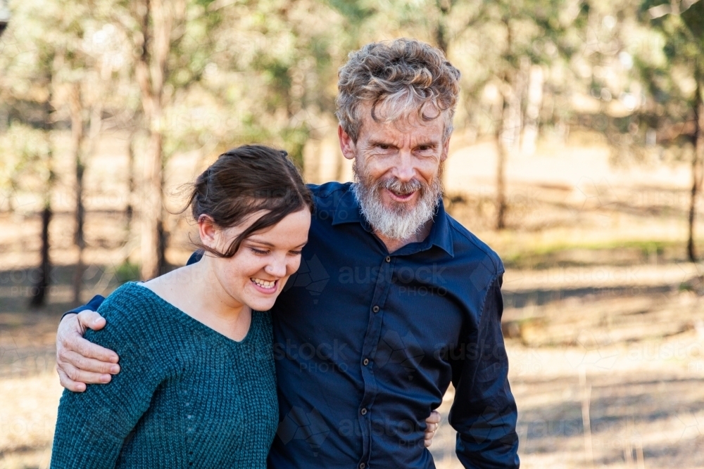Father and adult daughter hug - Australian Stock Image