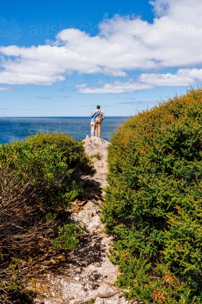 father and daughter at end of a hiking trail, north coast of Tasmania - Australian Stock Image