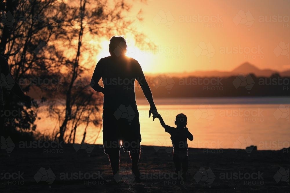 Father and son at sunset - Australian Stock Image