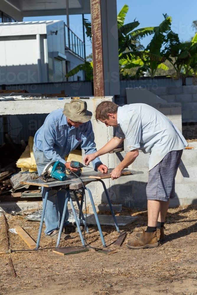 Father and son working - Australian Stock Image