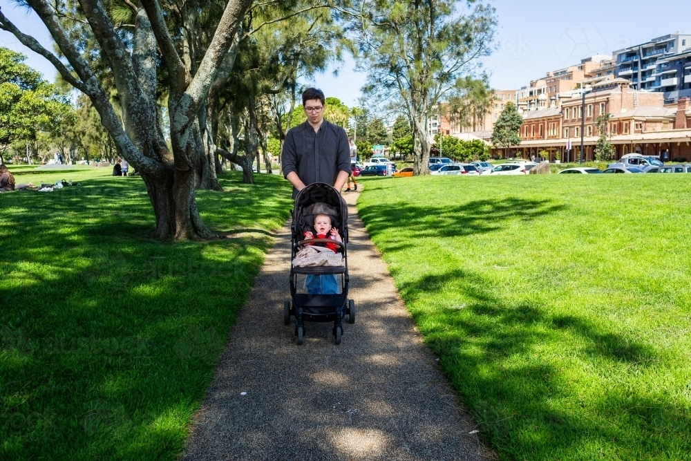 Pram Ramp Footpath Image of Father pushing pram down footpath with happy baby in Newcastle ...