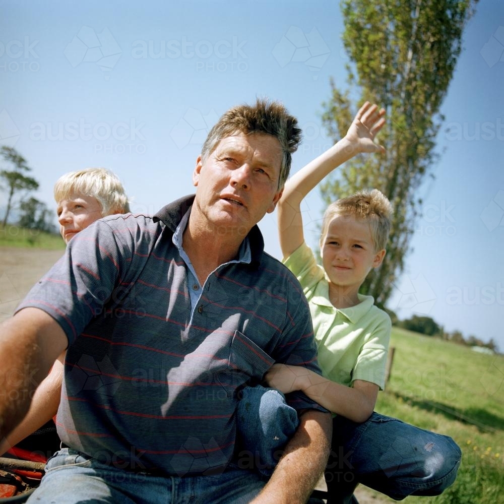 Father with kids on the farm - Australian Stock Image