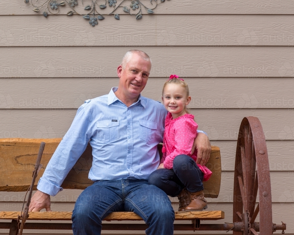Father with young daughter in pink - Australian Stock Image