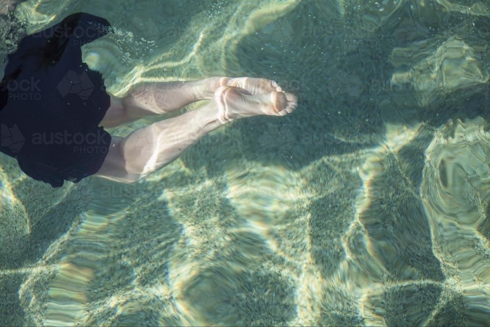 Feet in pool - Australian Stock Image